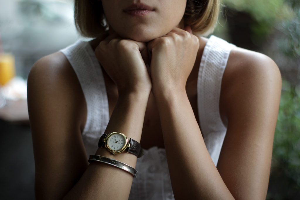 Girl resting chin on fists thinking