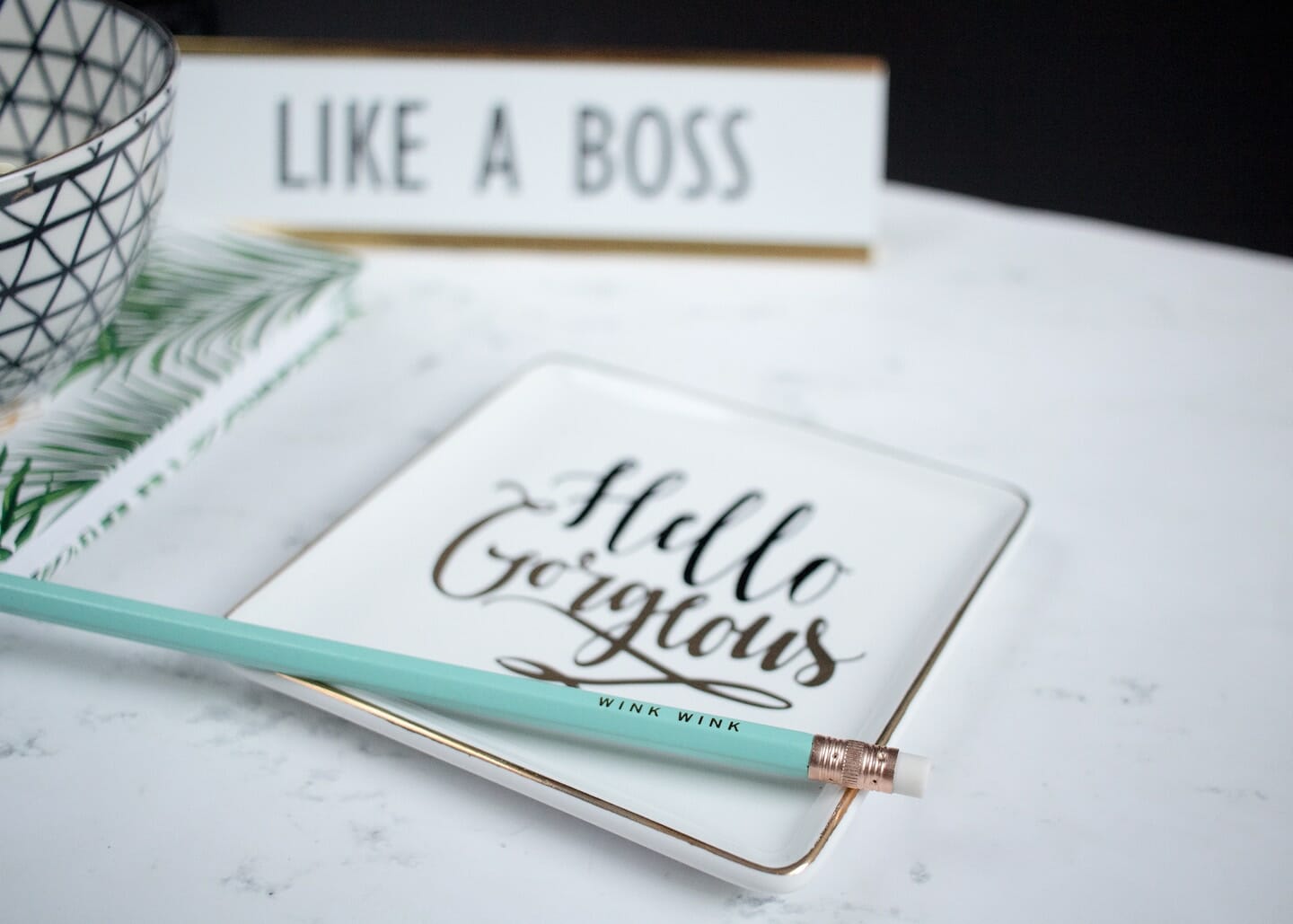 Notebook with "Hello Gorgeous " on the cover, "Like a Boss" name plate and light blue pencil