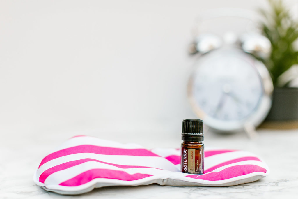 Sandal wood on pink and white striped cloth