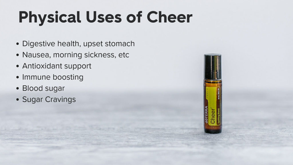 Rollerball of Cheer Essential oil rollerball on table with Physical uses