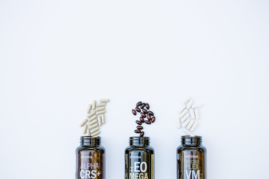 doTERRA LLV supplements opened on white background.