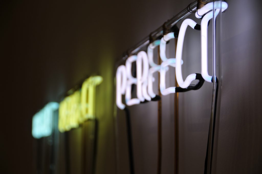 neon light that says "perfect"
