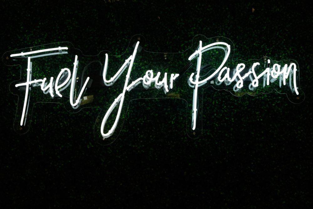 Fuel Your Passion in handwriting-esque neon lights