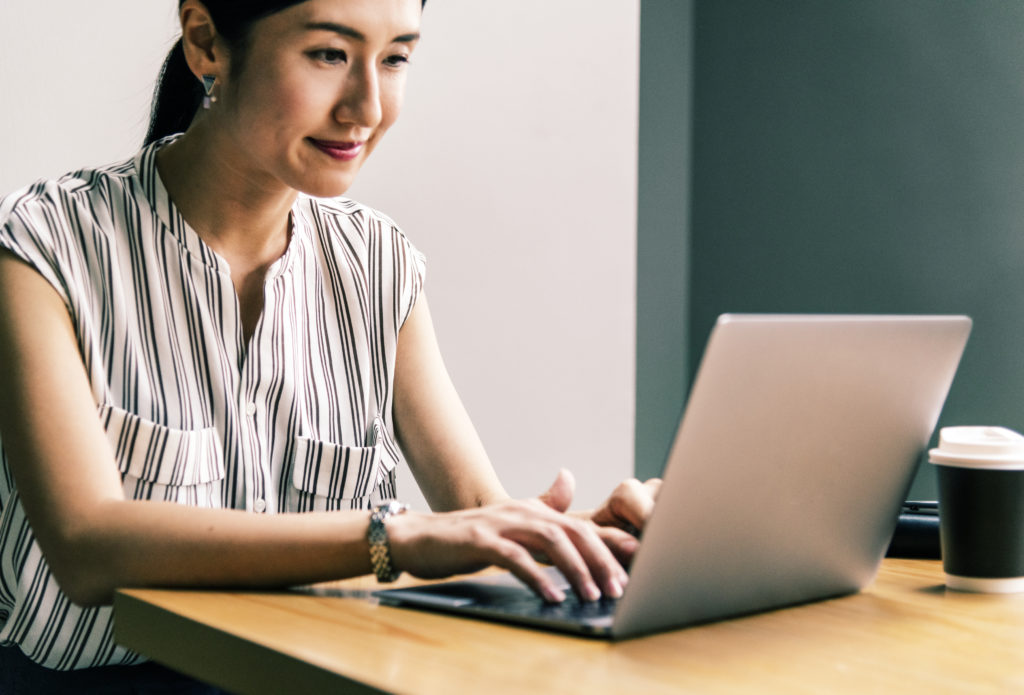 Japanese woman working on a laptop