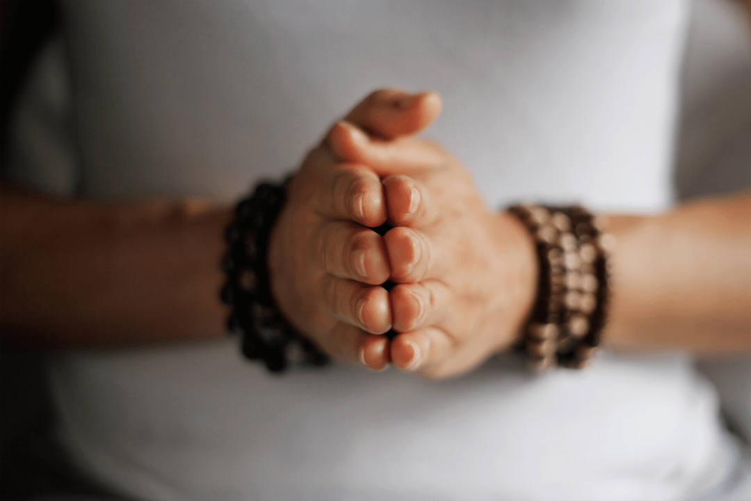 Hands together meditating What does Meditation Do?