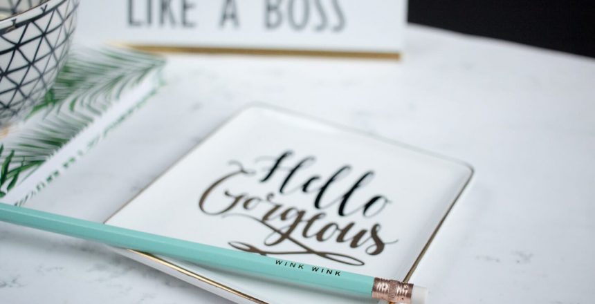 Notebook with "Hello Gorgeous " on the cover, "Like a Boss" name plate and light blue pencil