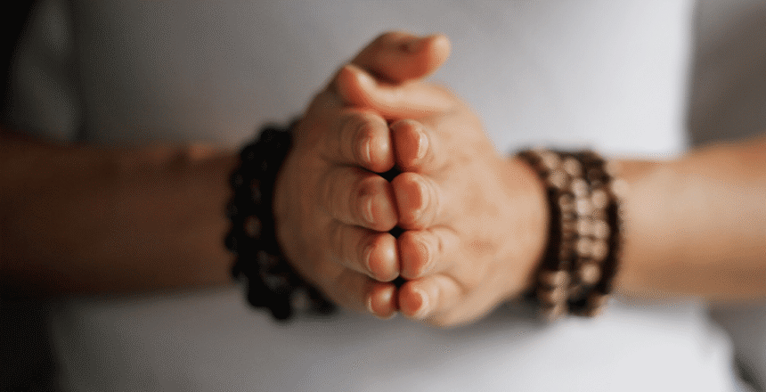 Hands together meditating What does Meditation Do?