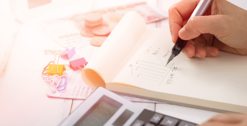 Woman calculating and writing