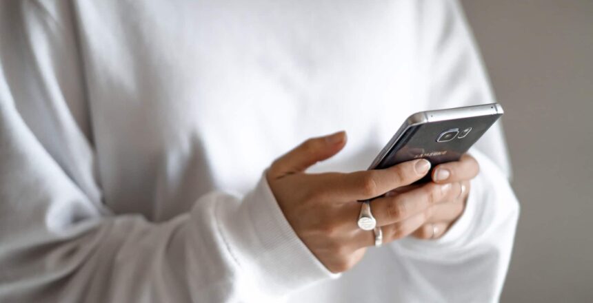 a girl procrastinating on her phone texting