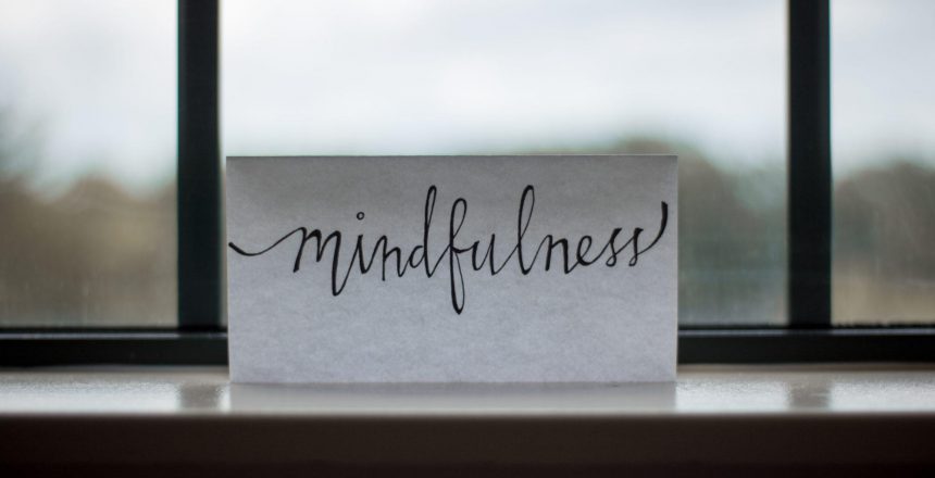 the word "mindfulness" on a piece of pape in the window