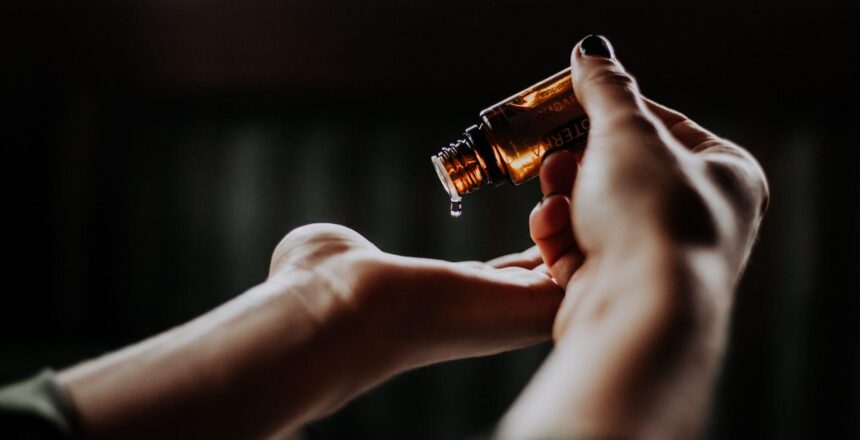 pouring oil out on to hand